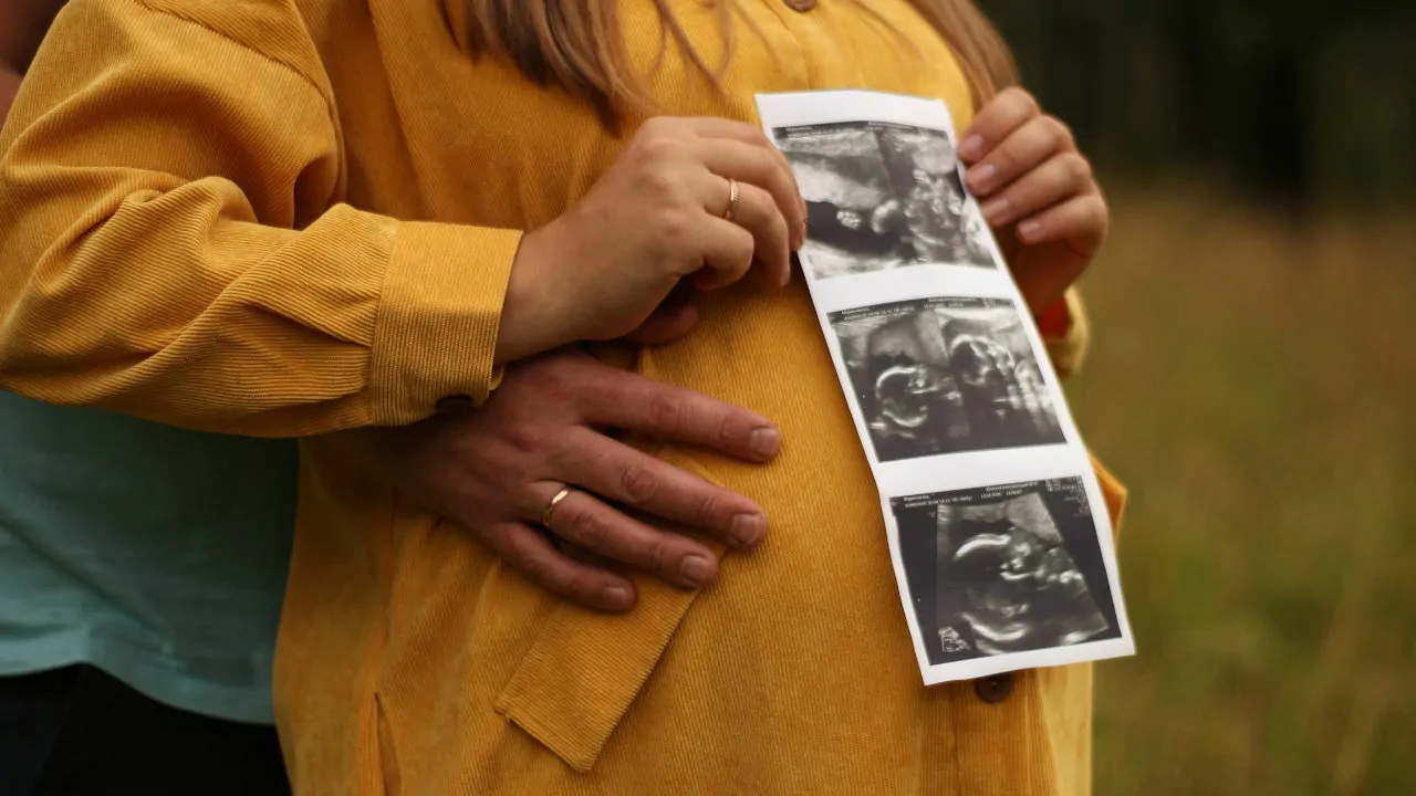 amniotic fluid inside the womb